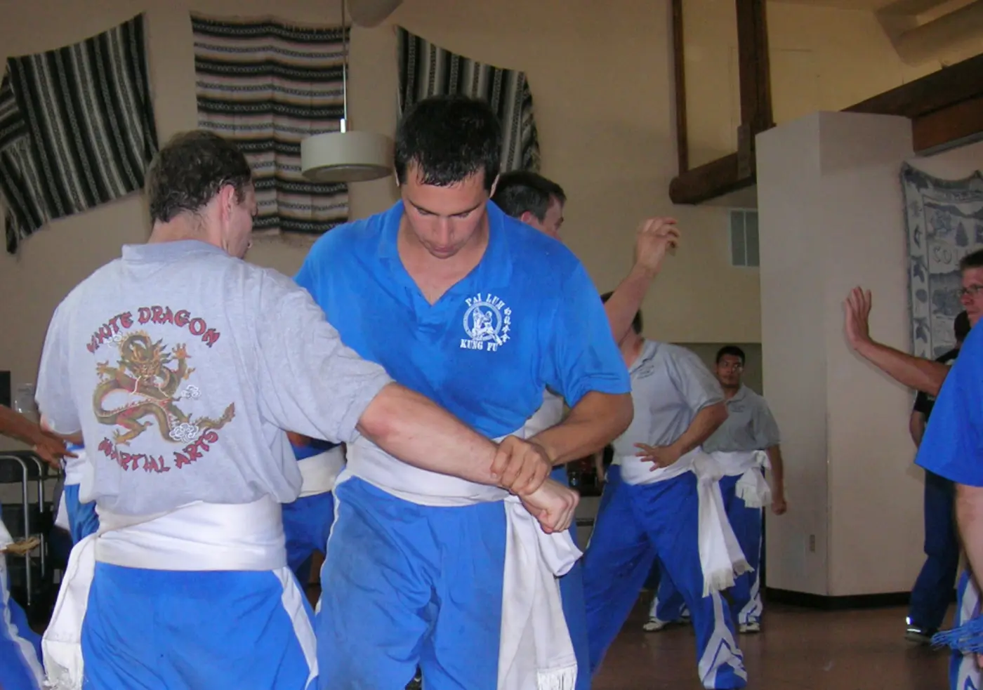 Sifu Miranda practicing with Sifu Quigley