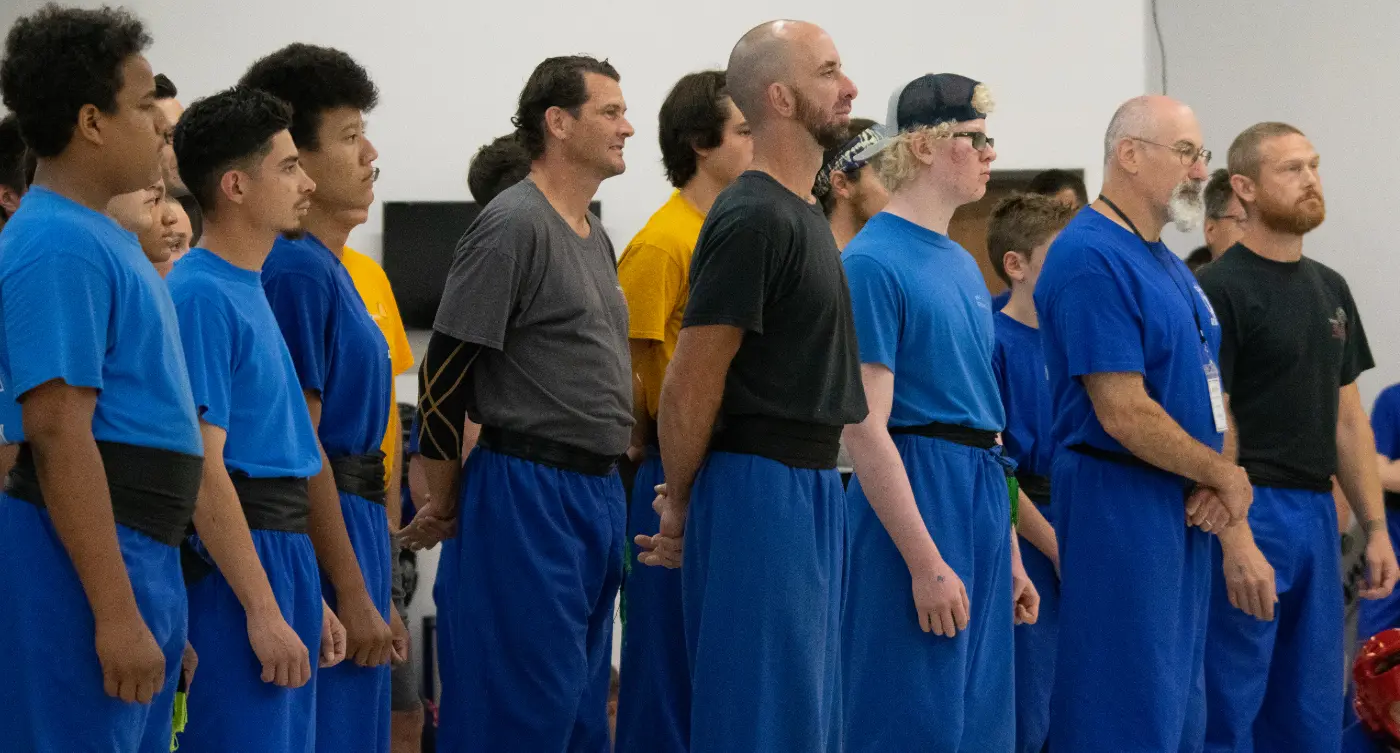 A group of students listening to instructions at a competition